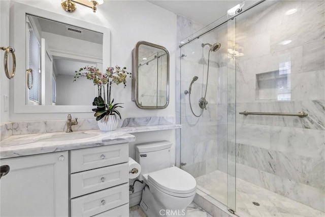 full bathroom featuring toilet, visible vents, and a shower stall