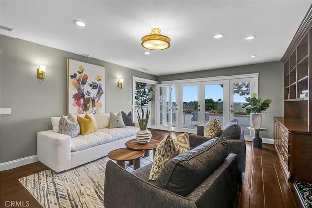 living area with dark wood-style flooring, french doors, recessed lighting, and baseboards