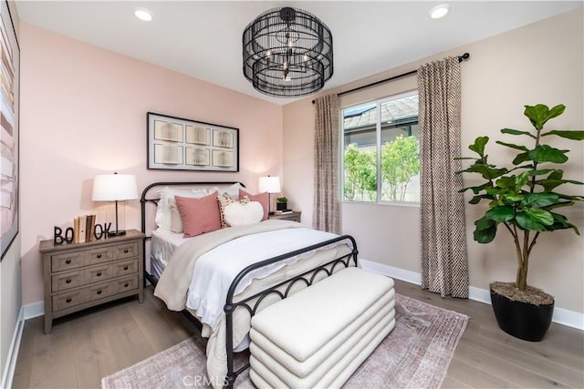 105 Great Park Blvd, Irvine, CA 92618 - bedroom with baseboards, recessed lighting, a notable chandelier, and wood finished floors