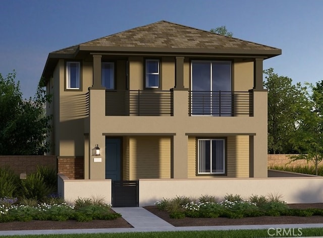 105 Great Park Blvd, Irvine, CA 92618 - view of front of property featuring a fenced front yard, stucco siding, and a balcony