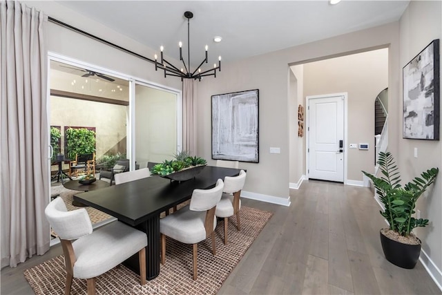 105 Great Park Blvd, Irvine, CA 92618 - dining room with baseboards, an inviting chandelier, and wood finished floors