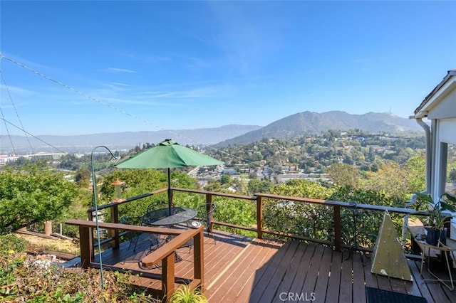 wooden terrace featuring a mountain view