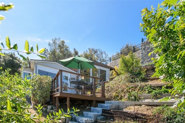 back of property with a deck