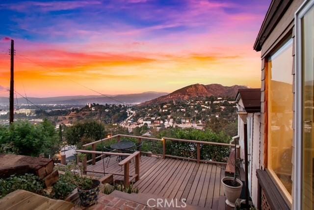 wooden terrace featuring a mountain view