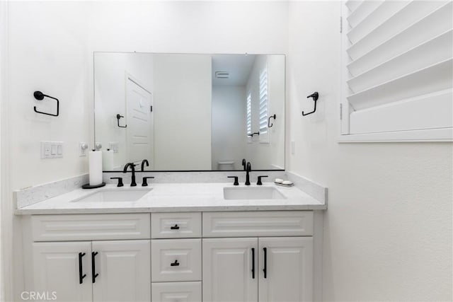 16015 Almond Ave, Chino, CA 91708 - full bath featuring toilet, double vanity, and a sink