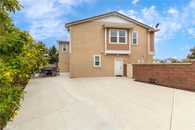 16015 Almond Ave, Chino, CA 91708 - back of house featuring fence, outdoor dining space, a patio area, and stucco siding
