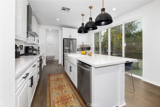 16015 Almond Ave, Chino, CA 91708 - kitchen with a sink, visible vents, stainless steel appliances, light countertops, and dark wood-type flooring