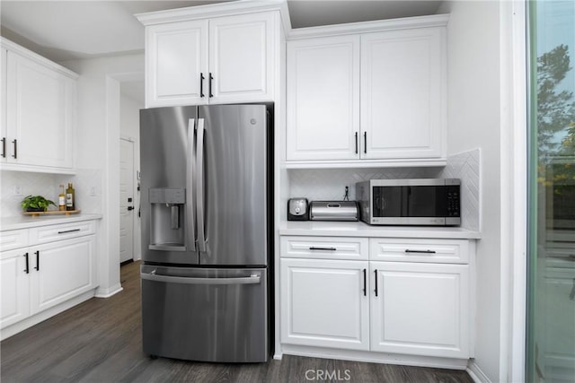 16015 Almond Ave, Chino, CA 91708 - kitchen with white cabinetry, decorative backsplash, appliances with stainless steel finishes, light countertops, and dark wood-type flooring