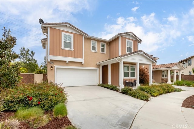 16015 Almond Ave, Chino, CA 91708 - craftsman inspired home featuring driveway, board and batten siding, a porch, and an attached garage
