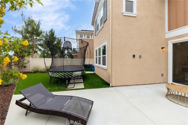 16015 Almond Ave, Chino, CA 91708 - view of patio featuring a trampoline and a fenced backyard