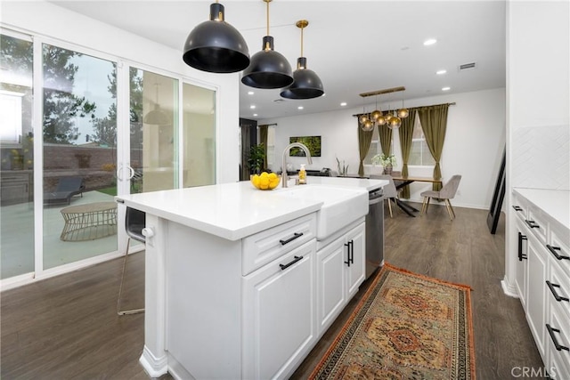 16015 Almond Ave, Chino, CA 91708 - kitchen with white cabinetry, a sink, visible vents, light countertops, and dark wood-style floors