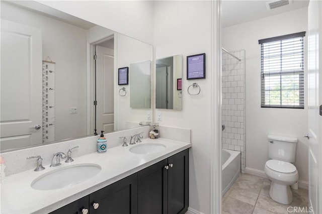 full bathroom with visible vents, a sink, double vanity, and toilet