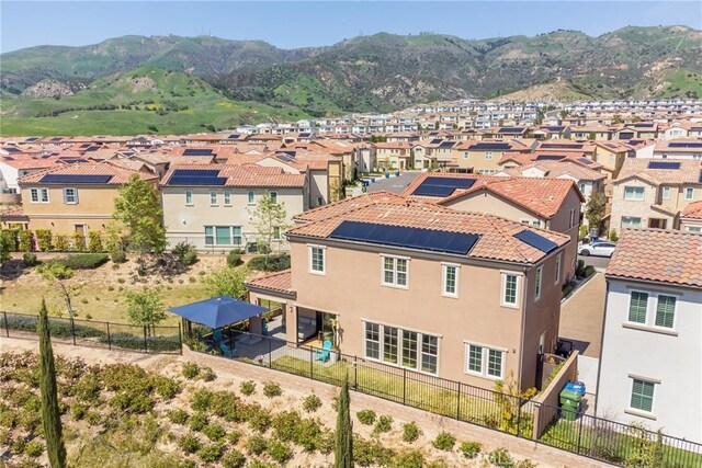 aerial view featuring a mountain view and a residential view