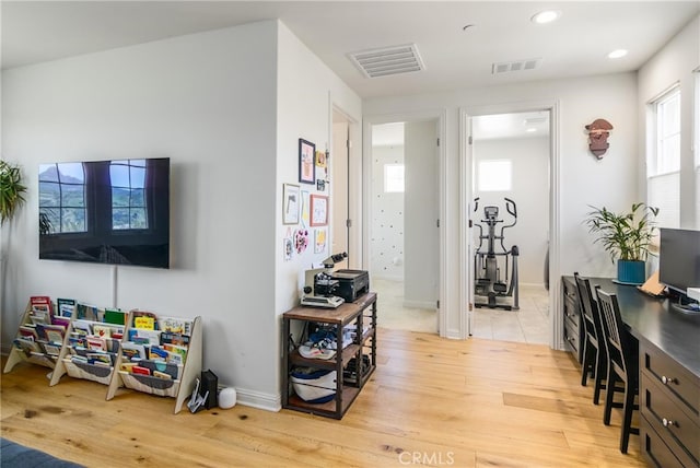 interior space with recessed lighting, light wood-style flooring, and visible vents