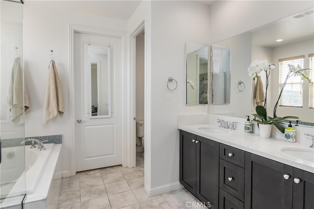 full bathroom featuring a bath, visible vents, toilet, and a sink