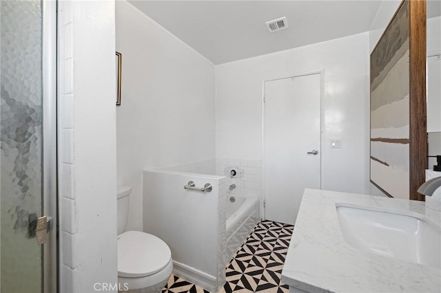 full bath featuring vanity, tile patterned floors, toilet, visible vents, and a bath