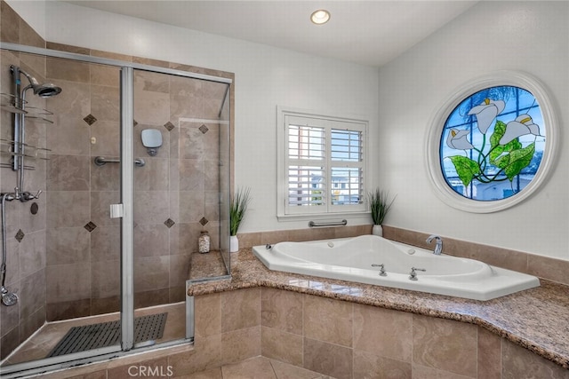 full bathroom with recessed lighting, a garden tub, and a stall shower
