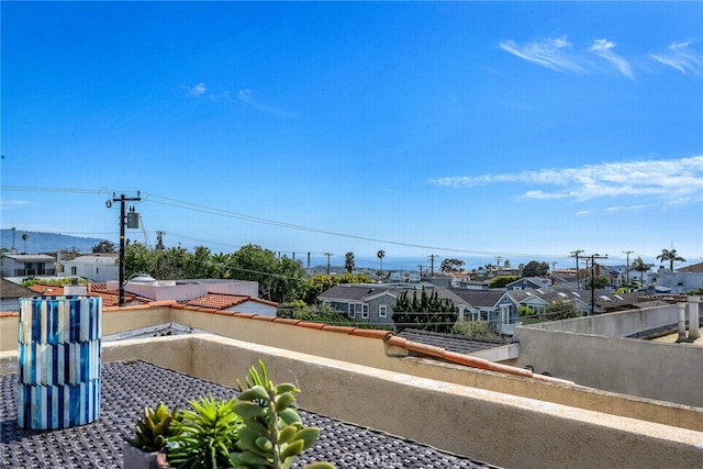 view of yard with a residential view and a balcony