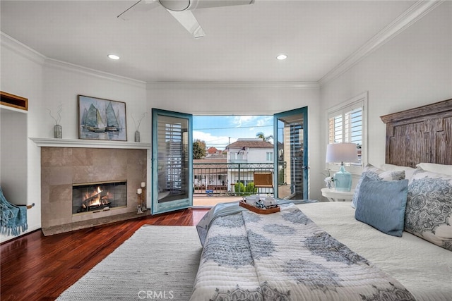 bedroom with ornamental molding, access to exterior, recessed lighting, and wood finished floors