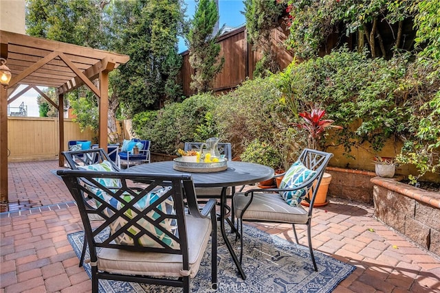 view of patio / terrace with a pergola, outdoor lounge area, a fenced backyard, and outdoor dining space