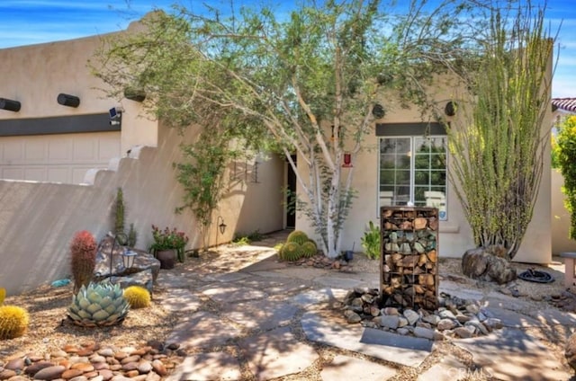 exterior space featuring stucco siding