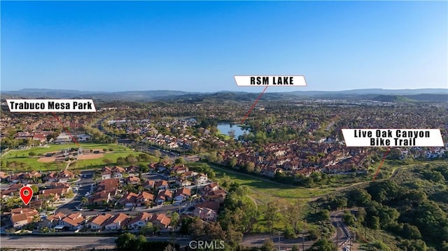 aerial view featuring a mountain view and a residential view