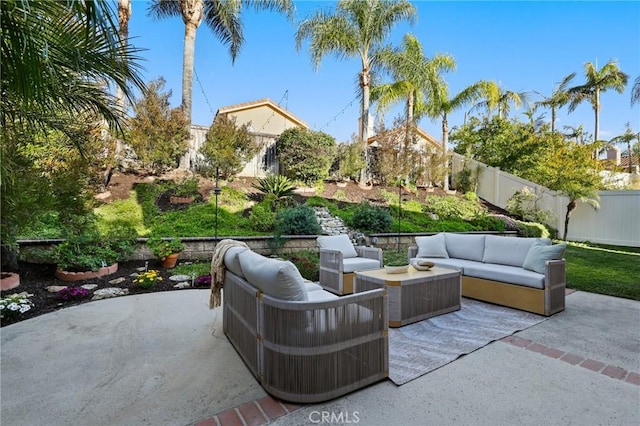view of patio / terrace with an outdoor living space and a fenced backyard