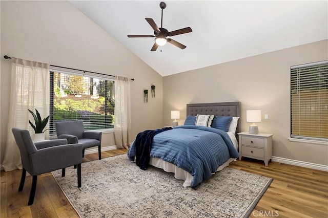 bedroom featuring high vaulted ceiling, ceiling fan, baseboards, and wood finished floors
