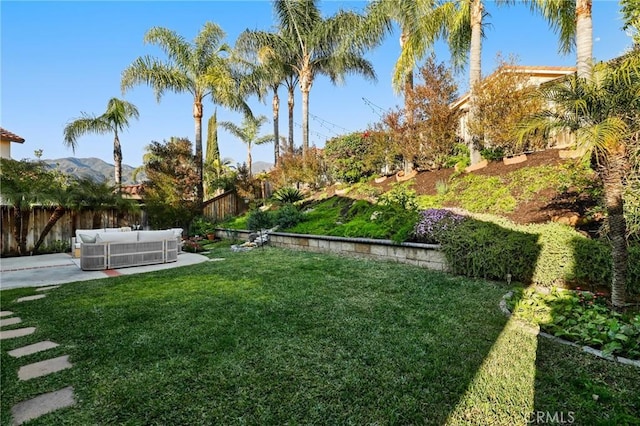view of yard featuring a fenced backyard, outdoor lounge area, and a patio