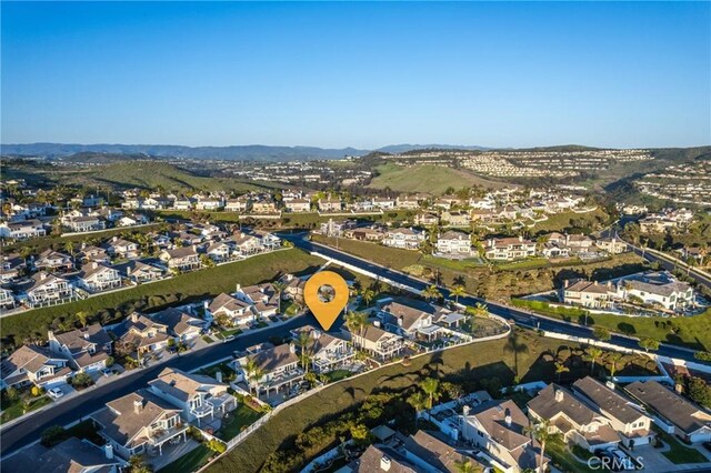 bird's eye view featuring a residential view and a mountain view