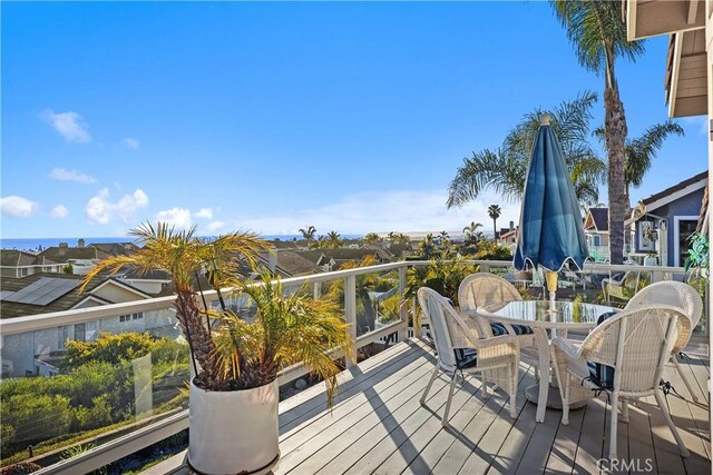 wooden deck with outdoor dining area