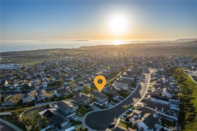 bird's eye view featuring a residential view and a water view