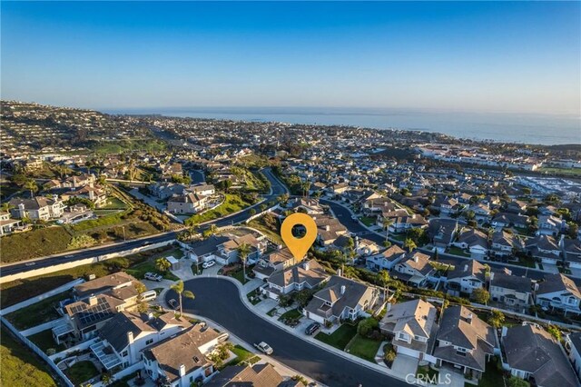 drone / aerial view with a residential view and a water view