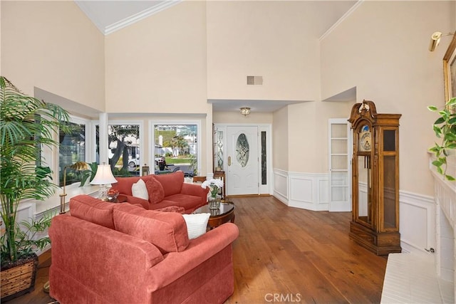 2107 Camino Laurel, San Clemente, CA 92673 - living room featuring ornamental molding, a high ceiling, wood finished floors, and a wainscoted wall