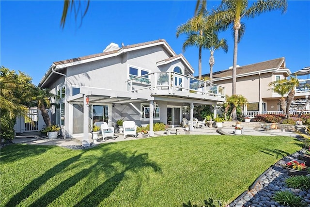 2107 Camino Laurel, San Clemente, CA 92673 - back of house featuring a balcony, a patio area, stucco siding, and a yard