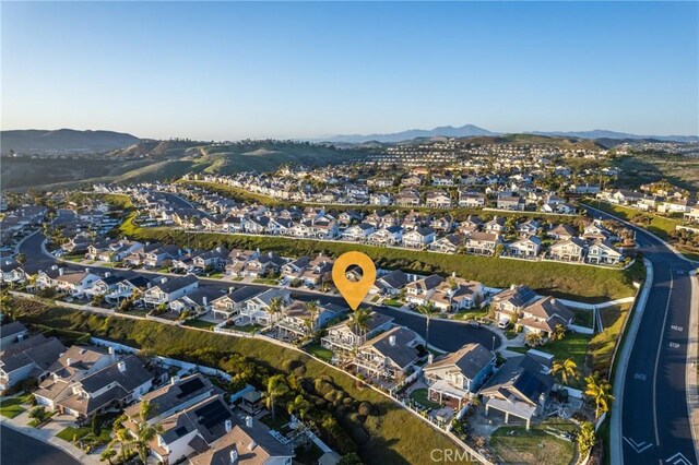 bird's eye view with a residential view and a mountain view