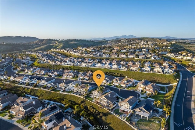 2107 Camino Laurel, San Clemente, CA 92673 - aerial overview of property's location with a mountainous background and nearby suburban area