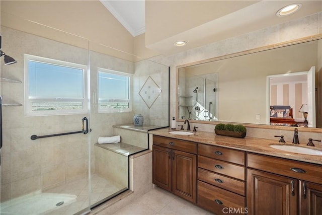 2107 Camino Laurel, San Clemente, CA 92673 - bathroom with vaulted ceiling, ornamental molding, a shower stall, double vanity, and tile patterned floors