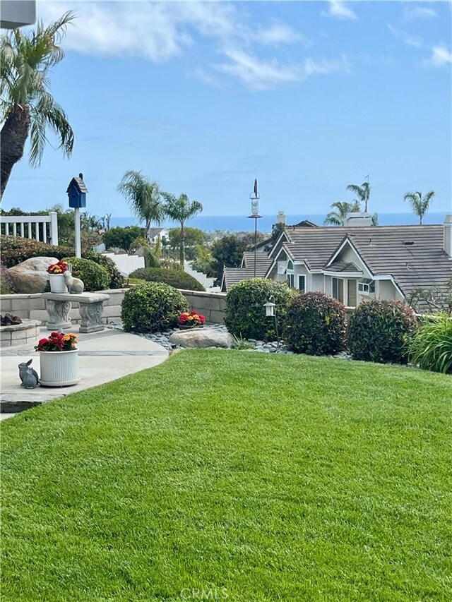 view of yard with fence and a patio