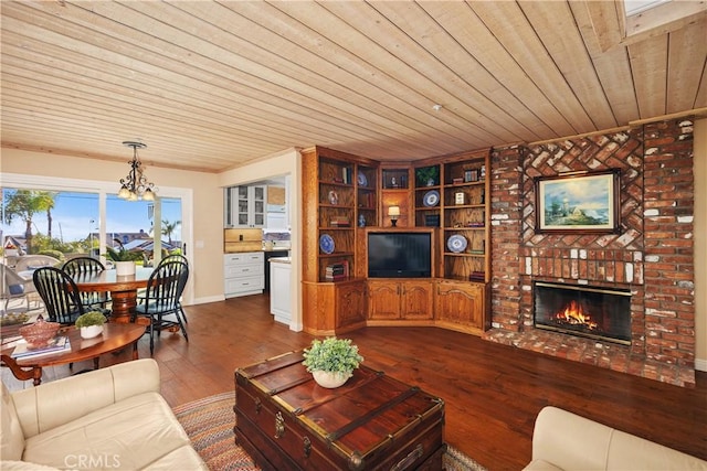 2107 Camino Laurel, San Clemente, CA 92673 - living room featuring wood ceiling, dark wood-type flooring, a chandelier, and a brick fireplace