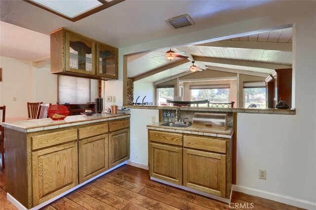 50366 Rd 420, Coarsegold, CA 93614 - kitchen with a peninsula, a sink, dark wood-type flooring, a ceiling fan, and healthy amount of natural light