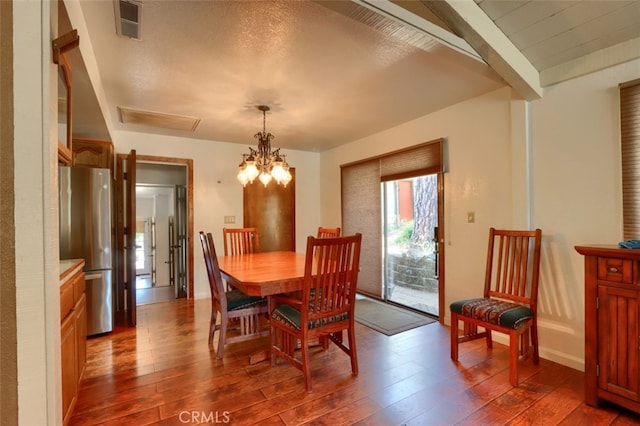 50366 Rd 420, Coarsegold, CA 93614 - dining room with dark wood-style floors, a chandelier, and beam ceiling