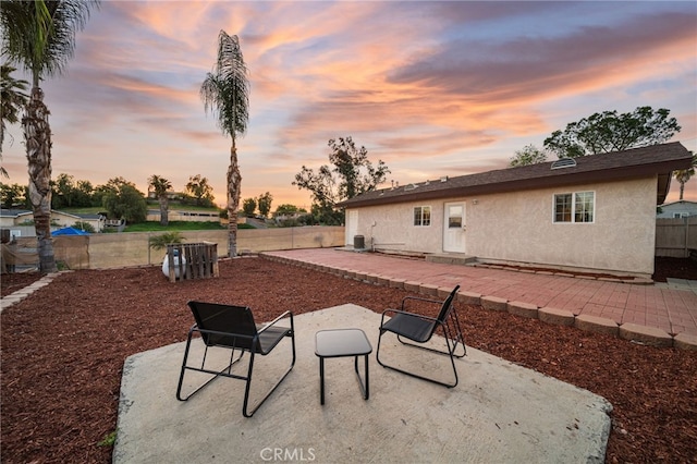 23755 Goetz Dr, Menifee, CA 92587 - patio terrace at dusk with fence and cooling unit