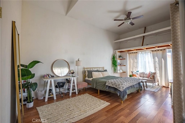 bedroom with ceiling fan and wood finished floors