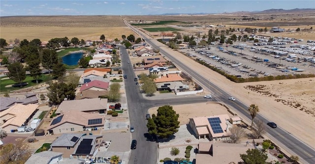 drone / aerial view featuring a water view and a residential view