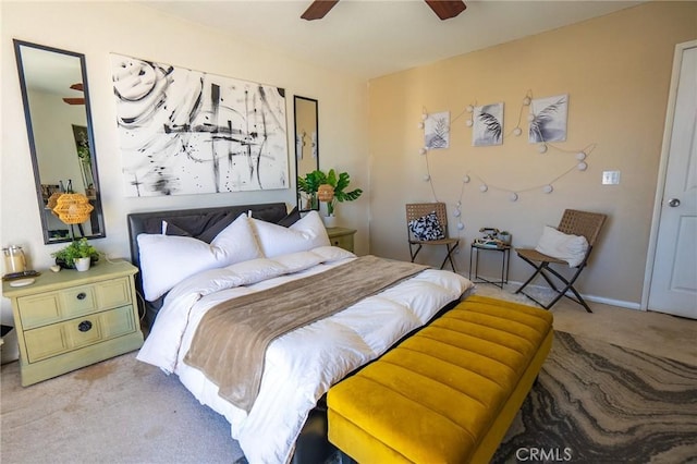 bedroom featuring baseboards, a ceiling fan, and carpet floors