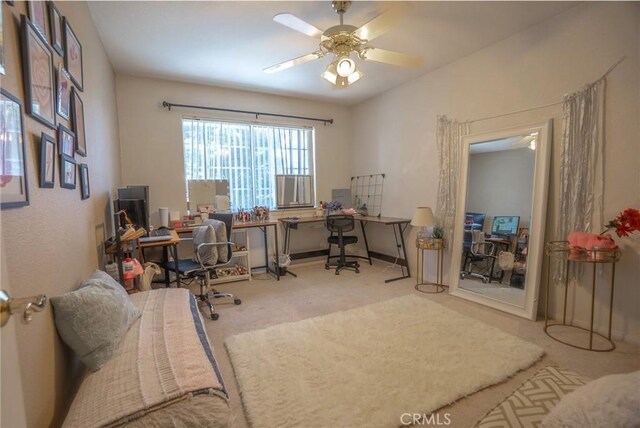 home office featuring ceiling fan and carpet flooring