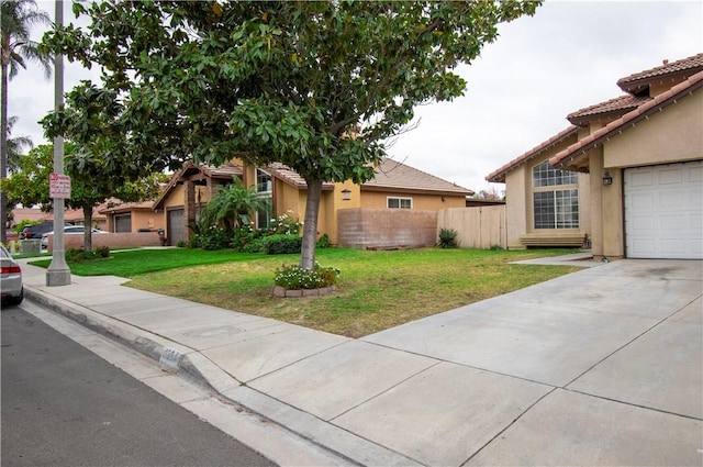 1284 William Mcgrath St, Colton, CA 92324 - view of front of property with stucco siding, a tile roof, and concrete driveway