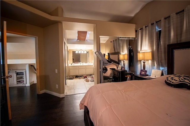 1284 William Mcgrath St, Colton, CA 92324 - bedroom with lofted ceiling, wood finished floors, baseboards, and ensuite bath
