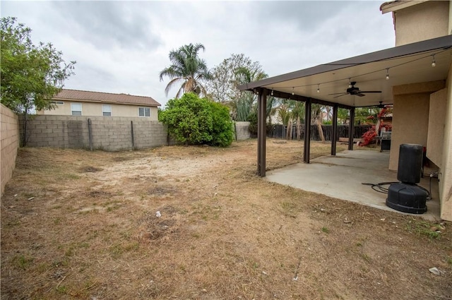 1284 William Mcgrath St, Colton, CA 92324 - fenced backyard featuring ceiling fan and a patio area